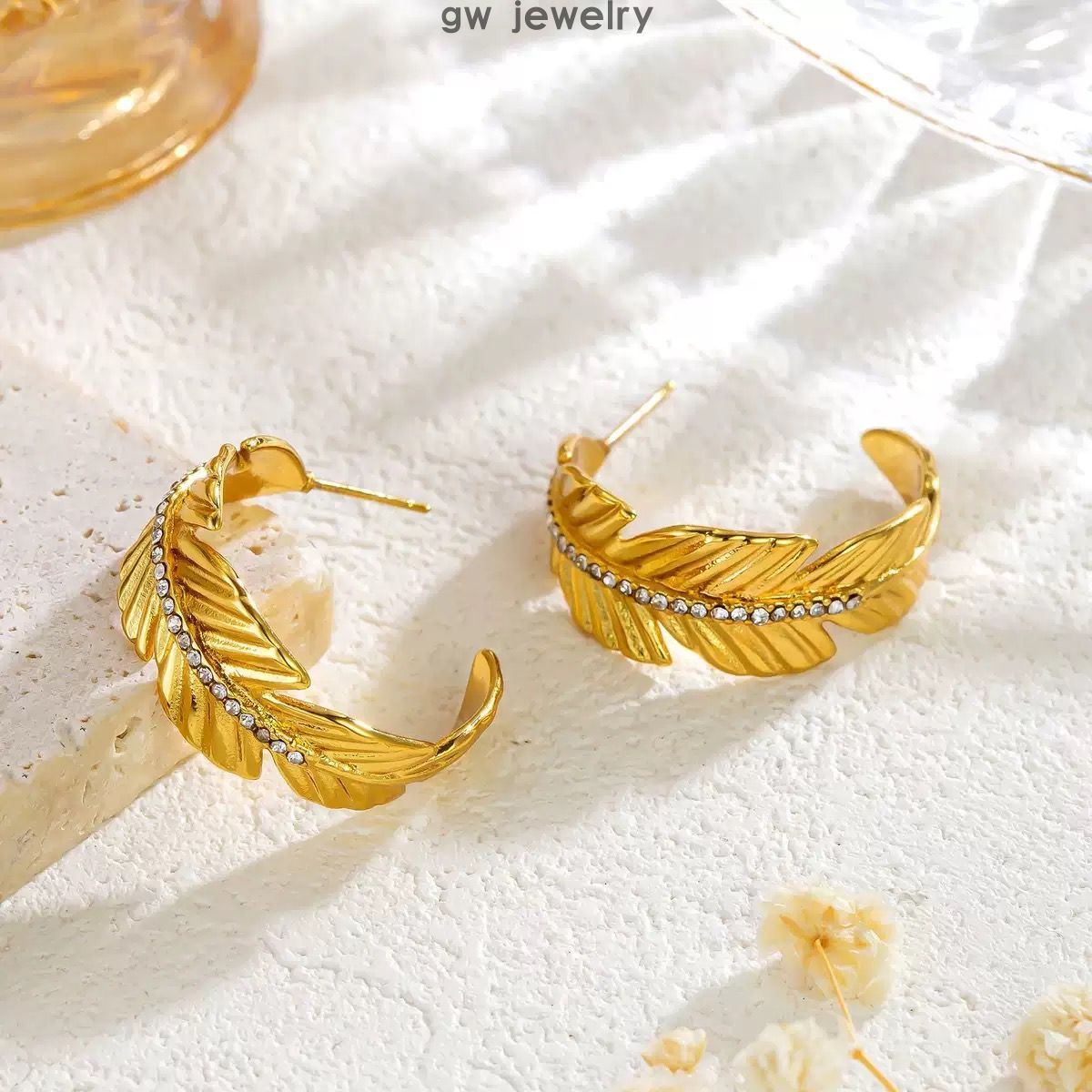 earrings inlaid with diamonds in the sha